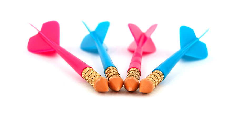 row of red and blue toy darts representing the concept of using multiple suppliers for plastic parts.